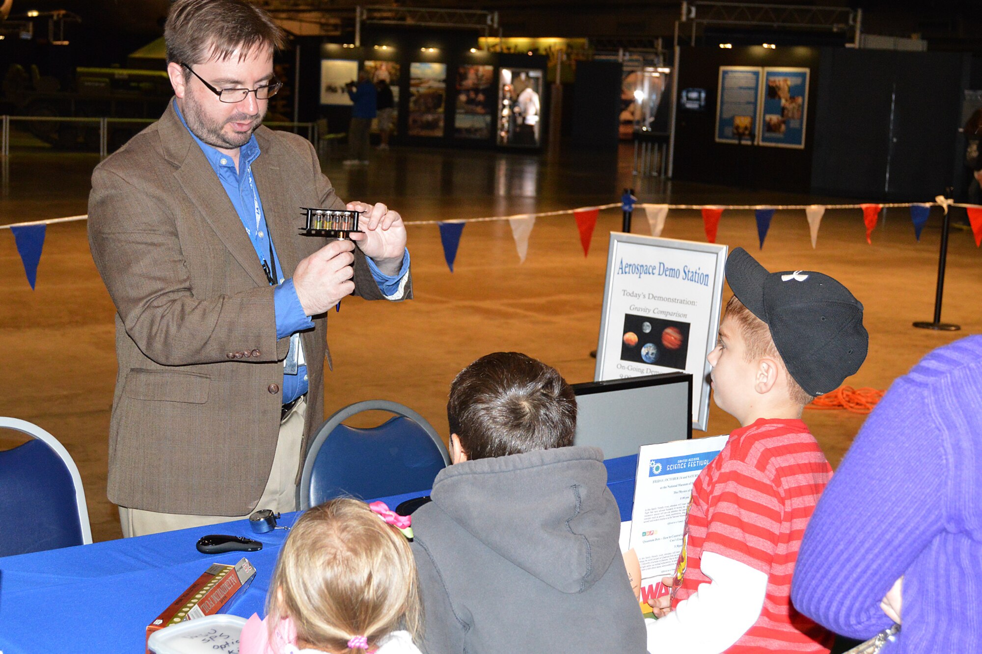 DAYTON, Ohio -- Students participate in laser demonstrations with Dr. James Deibel, professor at Wright State University, during Home School Day on October 6, 2014, at the National Museum of the U.S. Air Force. (U.S. Air Force photo)