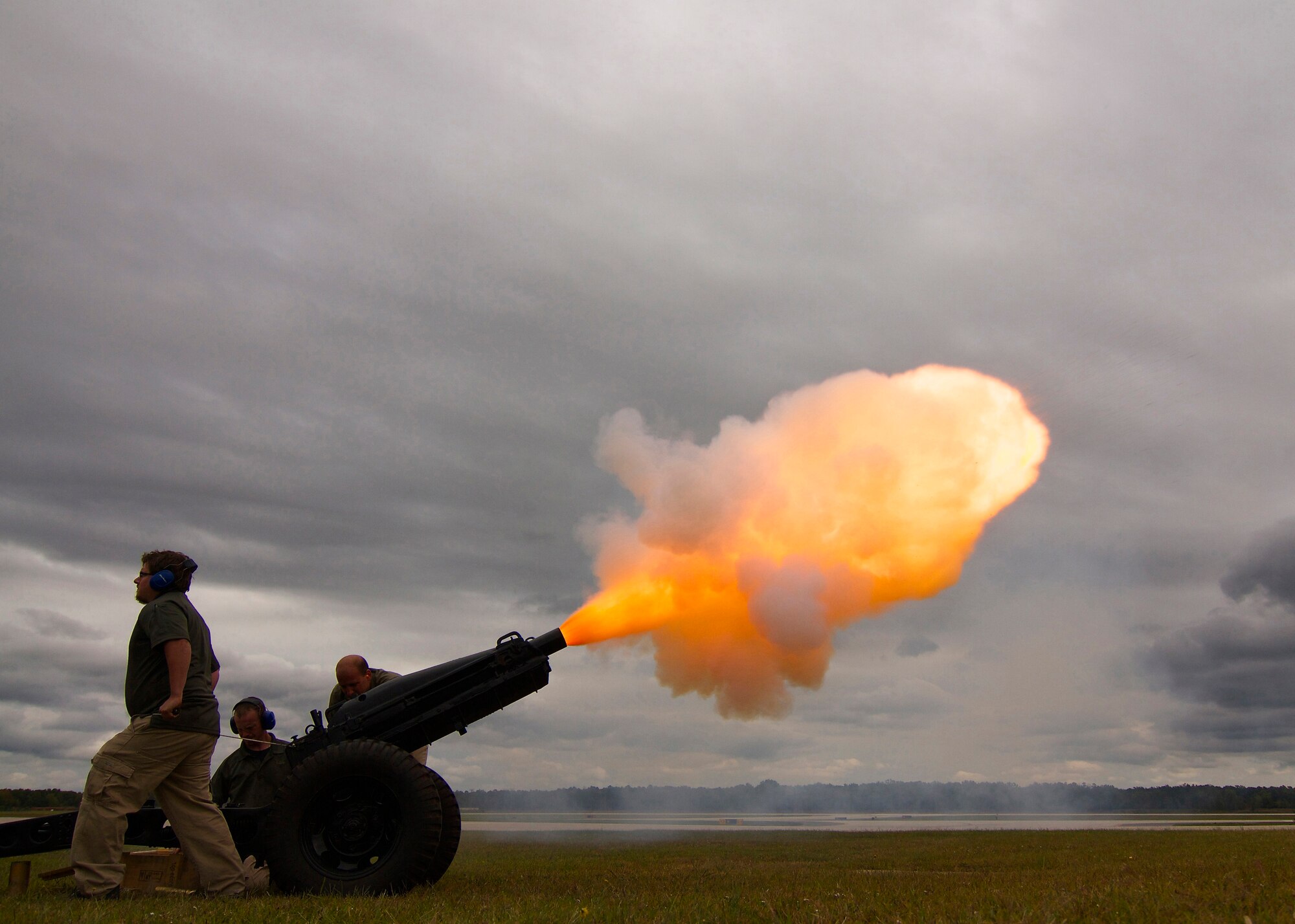 Technicians fire a blank round from a 75mm M1A1 (M116) howitzer, with M8 carriage, during a change of command ceremony for the Atlantic Division, 75th Training Command, at Joint Base McGuire-Dix-Lakehurst, N.J. Oct. 4, 2014. (Photo by Army Sgt. Reba Benally, Released)