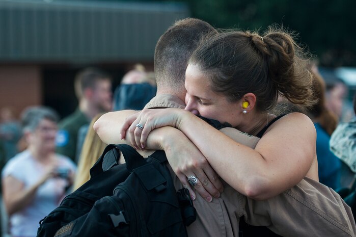 Captain Helen Cruz, 628th Communications Squadron cyber operations flight commander, hugs her husband Capt. James Cruz, 15th Airlift Squadron pilot, during the 15th AS redeployment Oct. 2, 2014, at Joint Base Charleston, S.C. The 15th Airlift Squadron is returning home from a two-month deployment to Southwest Asia.  Under the new Lead Wing Construct, the 15th Airlift Squadron was responsible for all three deployed C-17 bases in the Persian Gulf, executing up to 98 combat missions a week. With a 47 percent increase in manning requirements, the 15th AS received help from every one of Joint Base Charleston's active-duty sister squadrons, every 315th Airlift Wing Reserve Squadron and the Memphis Air National Guard.  They formed a formidable Total Force Integration team with phenomenal executional results that delivered more than 73 million pounds of cargo flying more than 4,400 combat hours.
(U.S. Air Force photo/Senior Airman George Goslin)