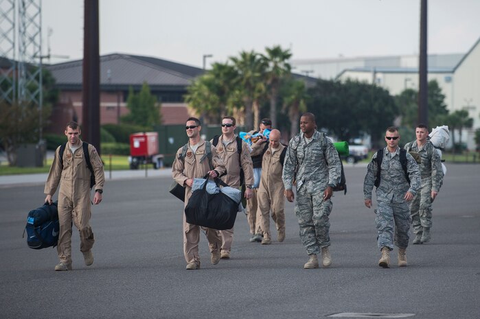 Members of the 15th Airlift Squadron return home from a deployment Oct. 2, 2014, at Joint Base Charleston, S.C. The 15th Airlift Squadron is returning from a two-month deployment to Southwest Asia.  Under the new Lead Wing Construct, the 15th Airlift Squadron was responsible for all three deployed C-17 bases in the Persian Gulf, executing up to 98 combat missions a week. With a 47 percent increase in manning requirements, the 15th AS received help from every one of Joint Base Charleston's active-duty sister squadrons, every 315th Airlift Wing Reserve Squadron and the Memphis Air National Guard.  They formed a formidable Total Force Integration team with phenomenal executional results that delivered more than 73 million pounds of cargo flying more than 4,400 combat hours.
 (U.S. Air Force photo/Senior Airman George Goslin)