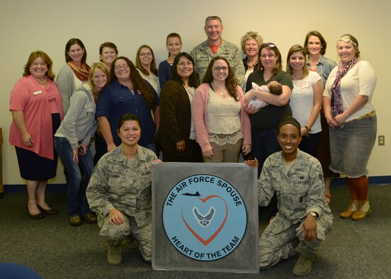 ALTUS AIR FORCE BASE, Okla. – U.S. Air Force Col. Bill Spangenthal stands with Heart Link participants, at the Airmen Resilience Center, Oct. 3, 2014. Heart Link is a commander’s program established to strengthen military families, increase awareness of the Air Force mission, and provide information about resources and services available to families. (U.S. Air Force photo by Airman 1st Class Nathan Clark/Released)
