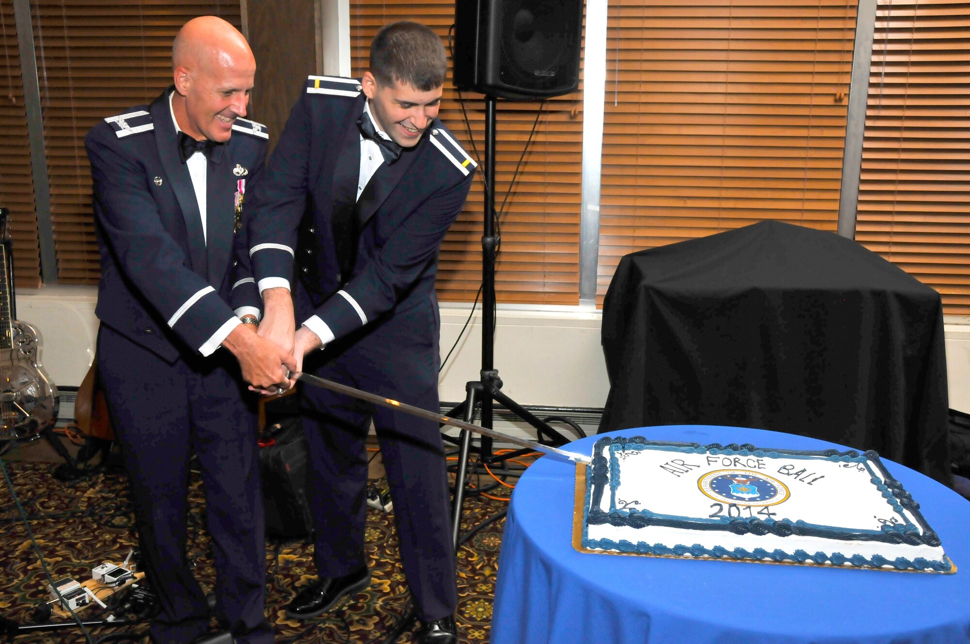 Col. James Krajewski (left), the director of the Arnold Engineering Development Complex (AEDC) Test Support Division, and 2nd Lt. Chris Handy, with the AEDC Propulsion Wind Tunnel Test Branch, cut the first piece of cake to celebrate the U.S. Air Force 67th birthday during the Air Force Ball at Arnold Air Force Base on Sept. 19. (Photo by Rick Goodfriend)