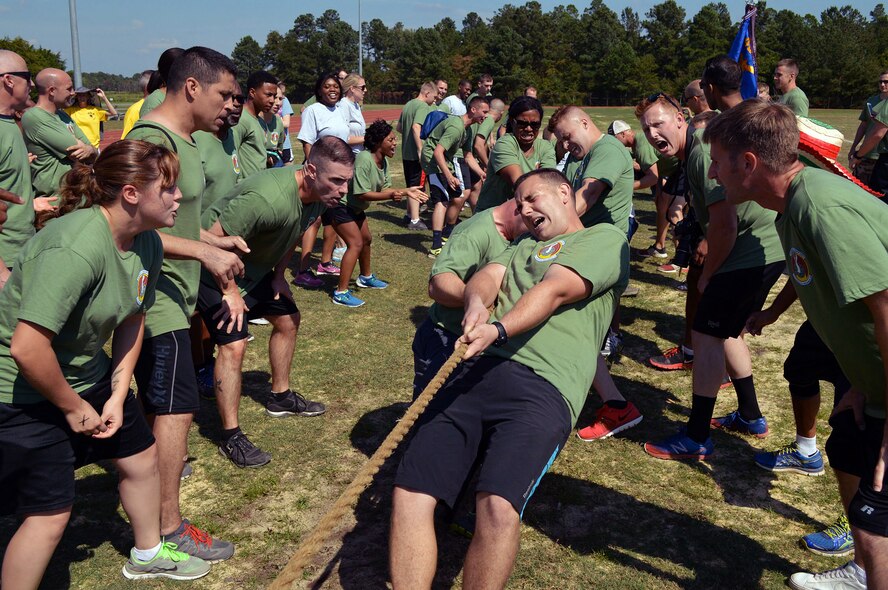 43rd Airlift Group Airmen participate in a Comprehensive Airman Fitness program sports day sponsored by the Air Force Sergeants Association, Chapter 367, on Oct. 3 at Pope Army Airfield, N.C. Activities included track and field events, mushball, softball, walleyball, basketball, dodgeball, tug-o-war, cornhole and a 3-mile ruck march. Squadron teams competed for trophies and the Group’s spirit flag. The 43rd Logistics Readiness Squadron and 43rd Force Support Squadron combined efforts to win 1st place overall and the Group’s spirit flag. (U.S. Air Force photo/Marvin Krause)