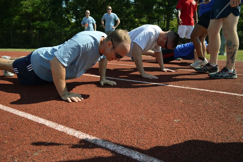 43rd Airlift Group Airmen participate in a Comprehensive Airman Fitness program sports day sponsored by the Air Force Sergeants Association, Chapter 367, on Oct. 3 at Pope Army Airfield, N.C. Activities included track and field events, mushball, softball, walleyball, basketball, dodgeball, tug-o-war, cornhole and a 3-mile ruck march. Squadron teams competed for trophies and the Group’s spirit flag. The 43rd Logistics Readiness Squadron and 43rd Force Support Squadron combined efforts to win 1st place overall and the Group’s spirit flag. (U.S. Air Force photo/Marvin Krause)