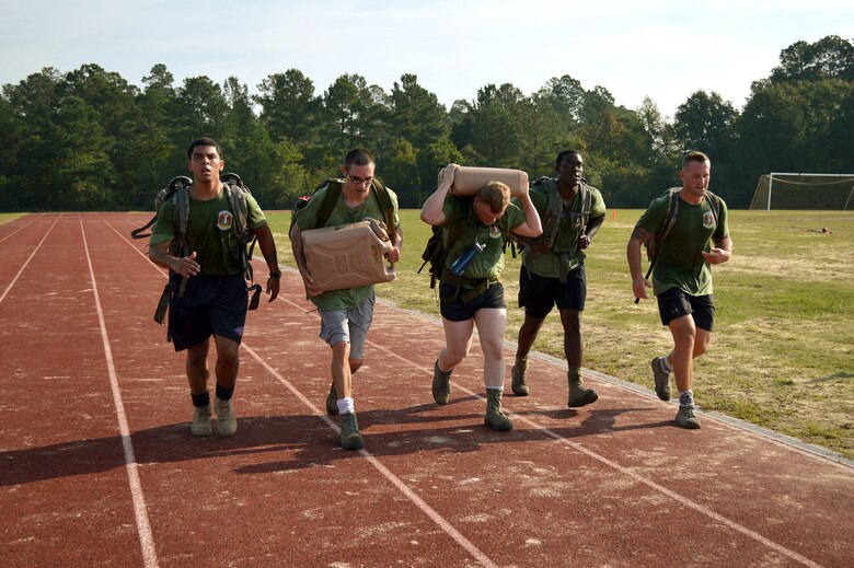 43rd Airlift Group Airmen participate in a Comprehensive Airman Fitness program sports day sponsored by the Air Force Sergeants Association, Chapter 367, on Oct. 3 at Pope Army Airfield, N.C. Activities included track and field events, mushball, softball, walleyball, basketball, dodgeball, tug-o-war, cornhole and a 3-mile ruck march. Squadron teams competed for trophies and the Group’s spirit flag. The 43rd Logistics Readiness Squadron and 43rd Force Support Squadron combined efforts to win 1st place overall and the Group’s spirit flag. (U.S. Air Force photo/Marvin Krause)