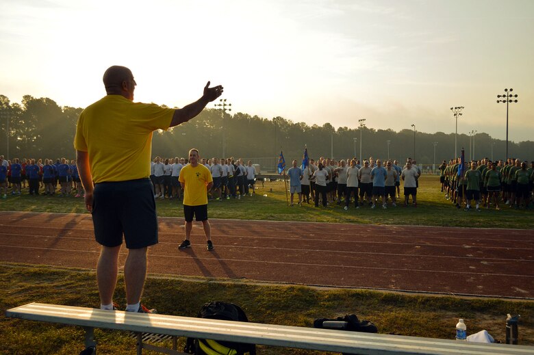 Col. Kenneth Moss, 43rd Airlift Group commander, welcomes Group Airmen to the Comprehensive Airman Fitness sports day sponsored by the Air Force Sergeants Association, Chapter 367, on Oct. 3 at Pope Army Airfield, N.C. Activities included track and field events, mushball, softball, walleyball, basketball, dodgeball, tug-o-war, cornhole and a 3-mile ruck march. Squadron teams competed for trophies and the Group’s spirit flag. The 43rd Logistics Readiness Squadron and 43rd Force Support Squadron combined efforts to win 1st place overall and the Group’s spirit flag. (U.S. Air Force photo/Marvin Krause)