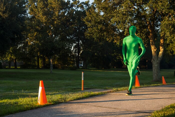 A runner in a body suit costume approaches the finish line during the commander’s challenge 5k run Oct. 3, 2014, at Joint Base Charleston, S.C. The runners were welcome to dress in costume to get into the Halloween spirit. The fastest male runner was Capt. Christopher Love, 628th Air Base Wing public affairs officer, with a time of 18:22. The fastest female runner was Capt. Marie Harnley, 628th Civil Engineer Squadron operations engineering chief, with a time of 20:57. (U.S. Air Force photo/Senior Airman George Goslin)
