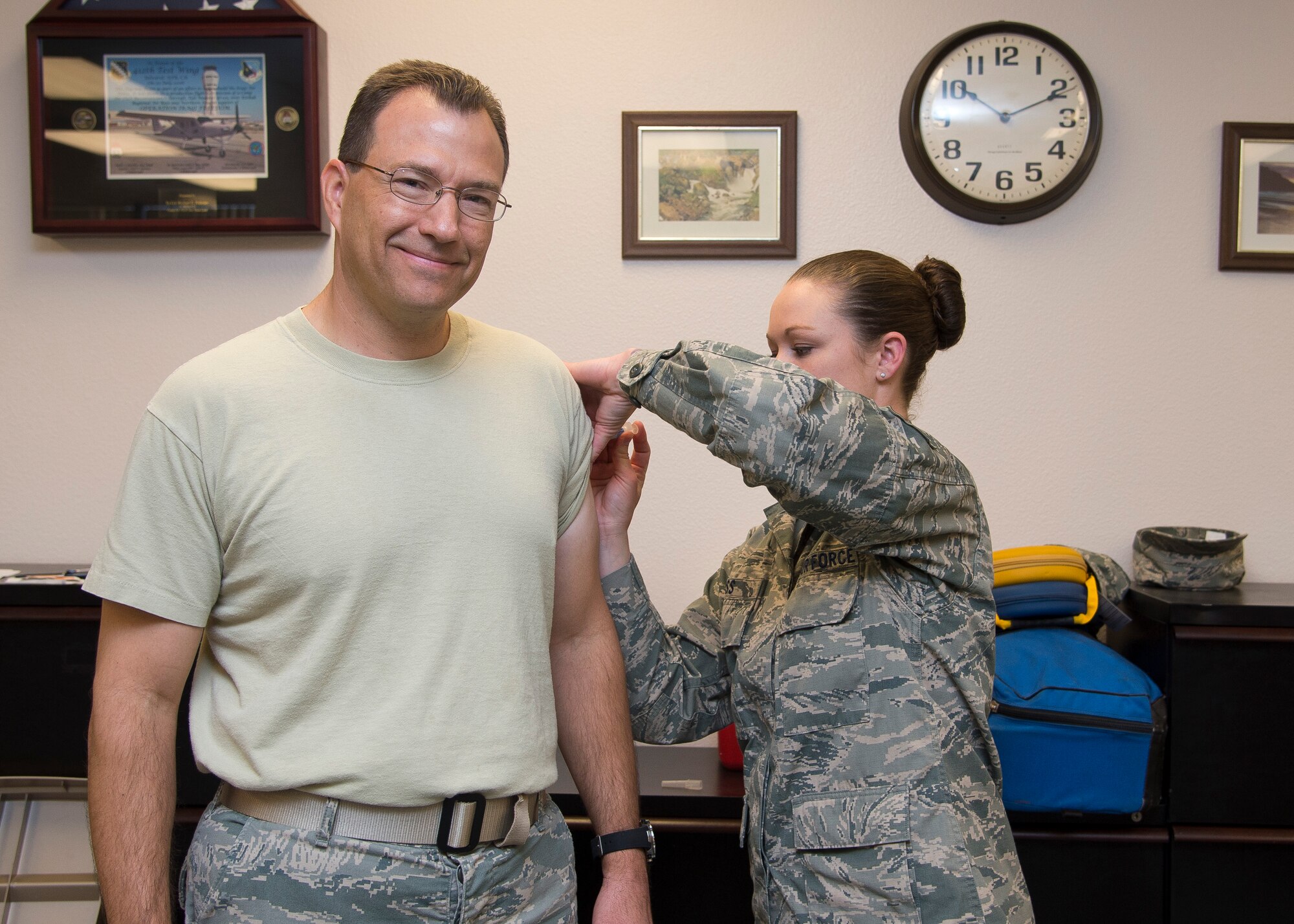 Col. David Radomski, 412th Test Wing vice commander, receives his flu shot Sept. 30 courtesy of Senior Airman Jessica Poss, 412th Medical Operations Squadron. Team Edwards are encouraged to get their shots in preparation for flu season. (U.S. Air Force photo by Ethan Wagner)