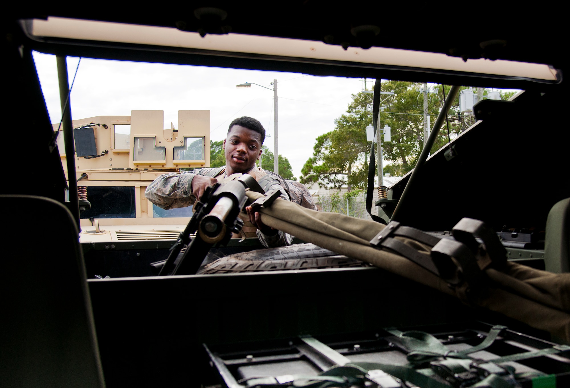 Senior Airman John Williams, 96th Logistics Readiness Squadron vehicle operations, loads a stretcher into a HMMWV prior to a combat operational readiness training exercise Oct. 3 at Eglin Air Force Base, Fla.  The training is an every-two-year requirement for all vehicle operations Airmen.  More than 20 completed the convoy operations missions that included inspections, attack scenarios and a medical evacuation.  (U.S. Air Force photo/Samuel King Jr.)