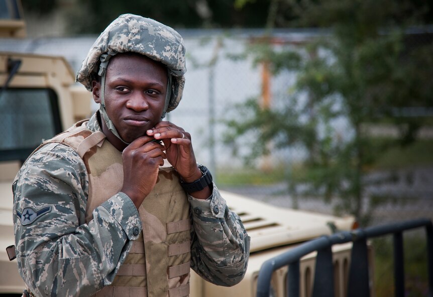 Airman Alfonso Taylor, 96th Logistics Readiness Squadron vehicle operations, adjusts his helmet prior to a combat operational readiness training exercise Oct. 3 at Eglin Air Force Base, Fla.  The training is an every-two-year requirement for all vehicle operations Airmen.  More than 20 completed the convoy operations missions that included inspections, attack scenarios and a medical evacuation.  (U.S. Air Force photo/Samuel King Jr.)