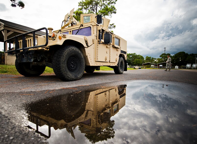 A HMMWV pulls forward into the convoy line prior to a vehicle operations combat operational readiness training exercise Oct. 3 at Eglin Air Force Base, Fla.  The training is an every-two-year requirement for all vehicle operations Airmen.  More than 20 completed the convoy operations missions that included inspections, attack scenarios and a medical evacuation.  (U.S. Air Force photo/Samuel King Jr.)