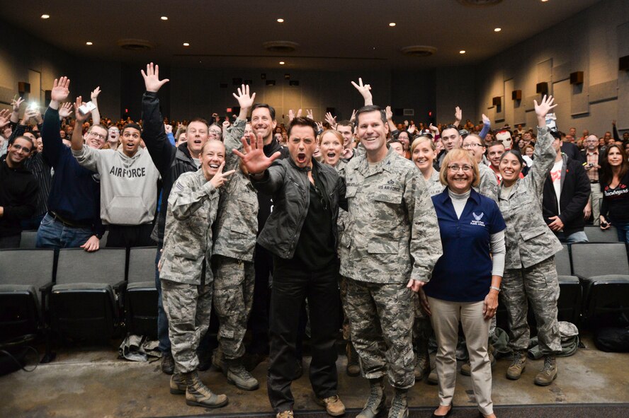 Movie star Robert Downey Jr. and U.S. Air Force Col. John Devillier, 88th Air Base Wing commander, pose for a photo with fans prior to the start of a special advance screening of the movie, “The Judge,” at Wright-Patterson Air Force Base, Ohio, Oct. 5, 2014. (U.S. Air Force photo by Wesley Farnsworth)(Released)