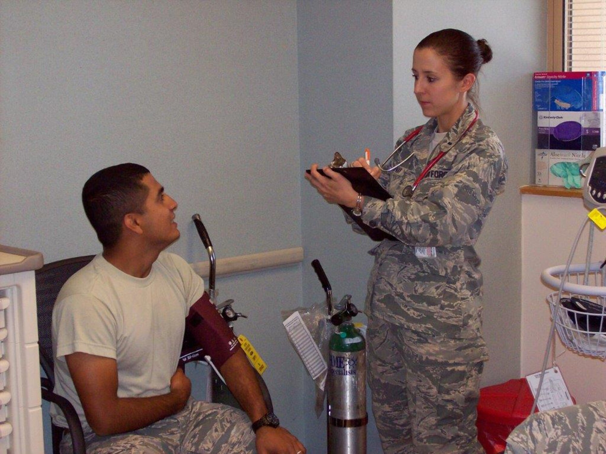 1st Lt. Zsuzsanna Krokovay, 377th Medical Group physician assistant, reviews a patient's chart. The Air Force has about 400 PAs assigned to medical groups, deployed locations and specialized duties. PA Week is Oct. 6-11. (Courtesy photo)