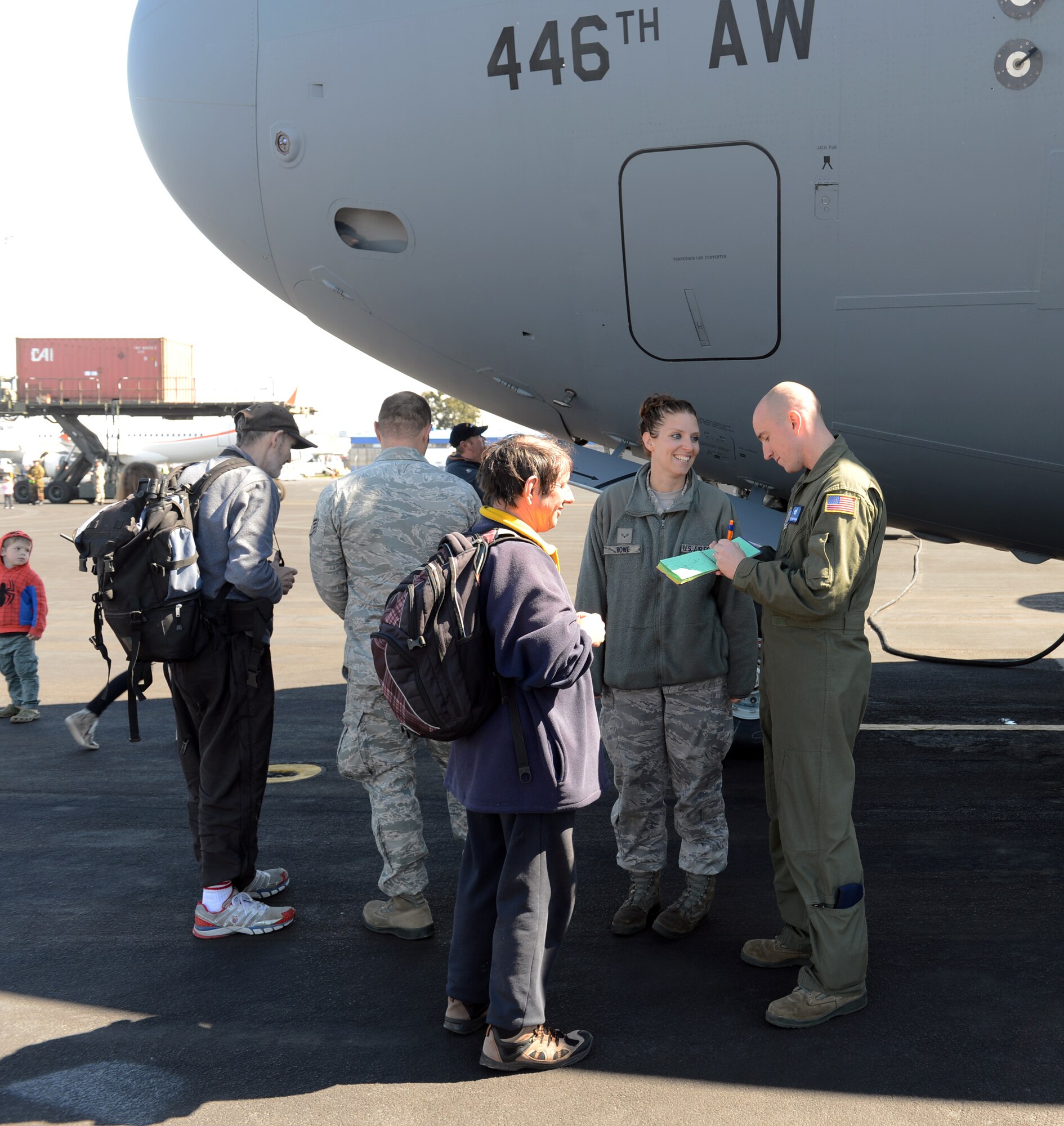 Tech. Sgt. Shawn Pharr, 304th Expeditionary Airlift Squadron and 62nd Aircraft Maintenance Squadron flying crew chief, signs an autograph for a visitor in front of the C-17 Globemaster III, Oct. 5th, 2014, as part of the U.S. Antarctic Program Day for IceFest 2014 at Christchurch, New Zealand. Many of the visitors stopped to ask the Airmen questions about the aircraft and its capabilities during this event. (U.S. Air Force photo/Master Sgt. Todd Wivell)