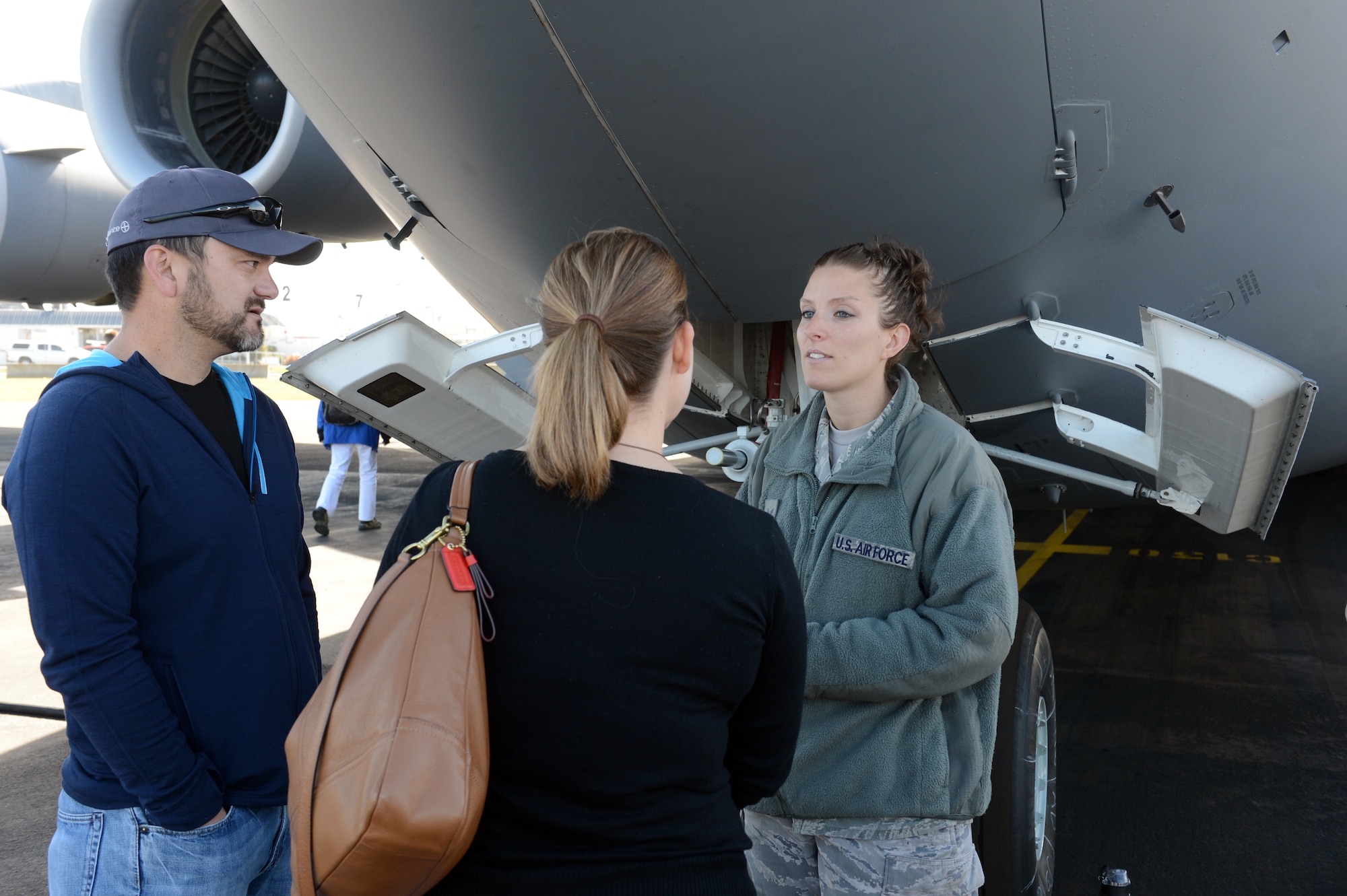 Senior Airman Jessica Rowe, 304th Expeditionary Airlift Squadron and 62nd Maintenance Squadron hydraulics journeyman, talks with visitors about the capabilities of the C-17 Globemaster III, Oct. 5th, 2014, as part of the U.S. Antarctic Program Day for IceFest 2014 at Christchurch, New Zealand. For more than six hours, 600 participants every half hour came through to see the C-17 and to interact with the McChord Airmen. (U.S. Air Force photo/Master Sgt. Todd Wivell)