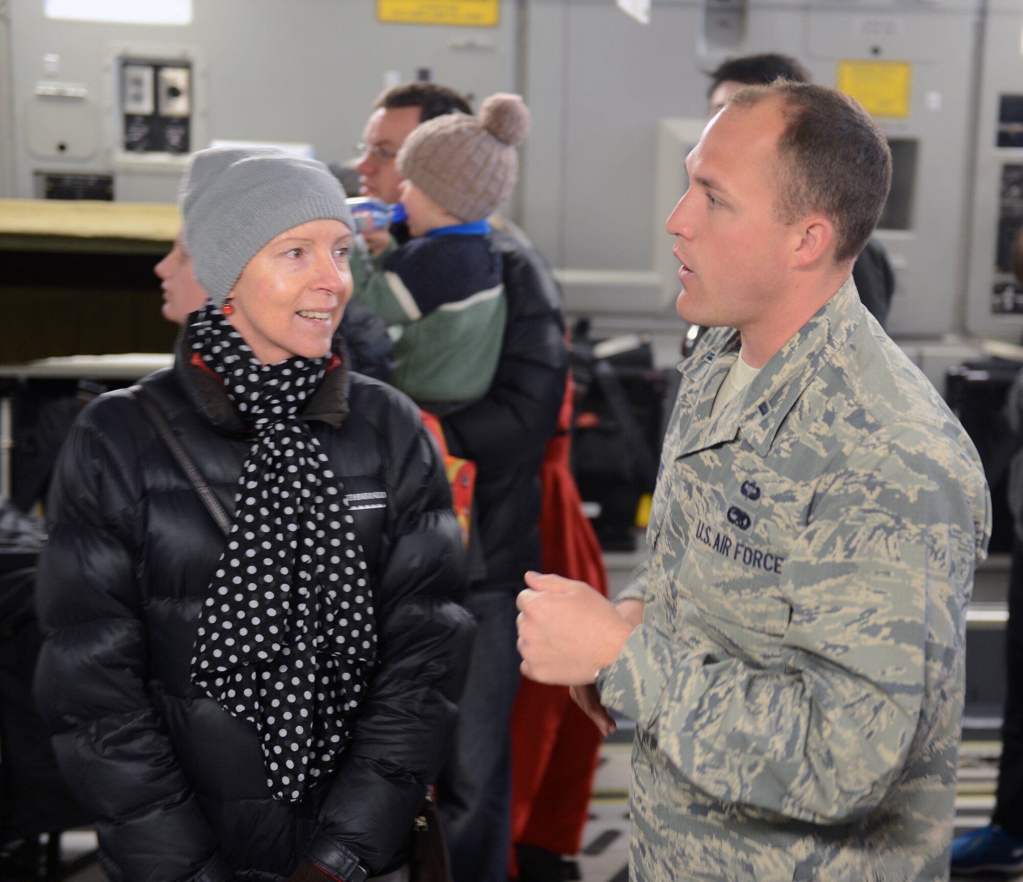 1st Lt. Jim Evans, 304th Expeditionary Airlift Squadron maintenance officer in charge and 62nd Maintenance Squadron fabrication flight commander, talks with a New Zealand woman about the capabilities of the C-17 Globemaster III, Oct. 5th, 2014, as part of the U.S. Antarctic Program Day for IceFest 2014 at Christchurch, New Zealand. The 62nd Airlift Wing sent 11 maintenance members down to Christchurch in support of Operation DEEP FREEZE. (U.S. Air Force photo/Master Sgt. Todd Wivell)