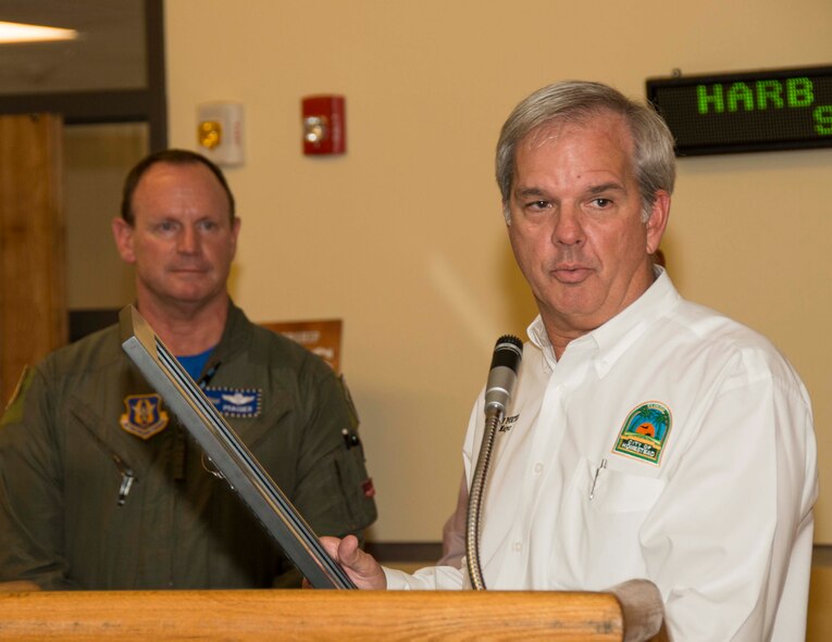 City of Homestead Mayor Jeff Porter presents the proclamation to Col. Chris Funk, 482nd Fighter Wing commander at Homestead Air Reserve Base, Fla., during a Military Affairs Committee meet and greet, held in honor of the wing, in the Community Activity Center on Homestead ARB Oct. 3. The proclamation stated that Oct. 3 is now 482nd FW day for the city of Homestead, Fla. (U.S. Air Force photo by Senior Airman Jaimi L. Upthegrove)
