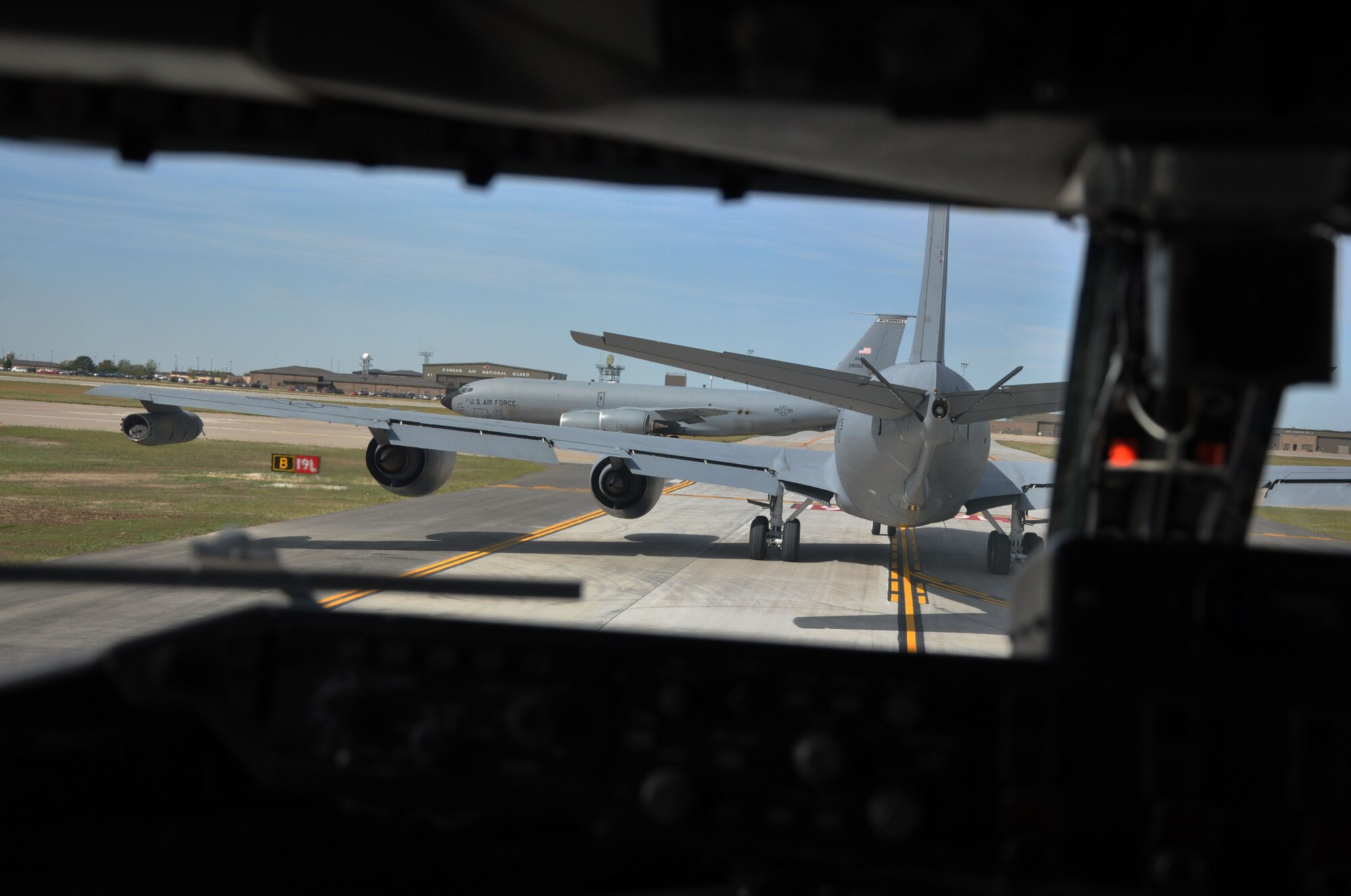 A KC-135 Stratotanker assigned to McConnell Air Force base taxis down the flightline with nine other McConnell KC-135s here, Oct. 4, 2014.  Members of the 931st Aircraft Maintenance Squadron and 931st Operations Supports Squadron successfully launched nine KC-135s in thirty-second intervals during the October Unit Training Assembly.  (U.S. Air Force photo by Staff Sgt. Abigail Klein)