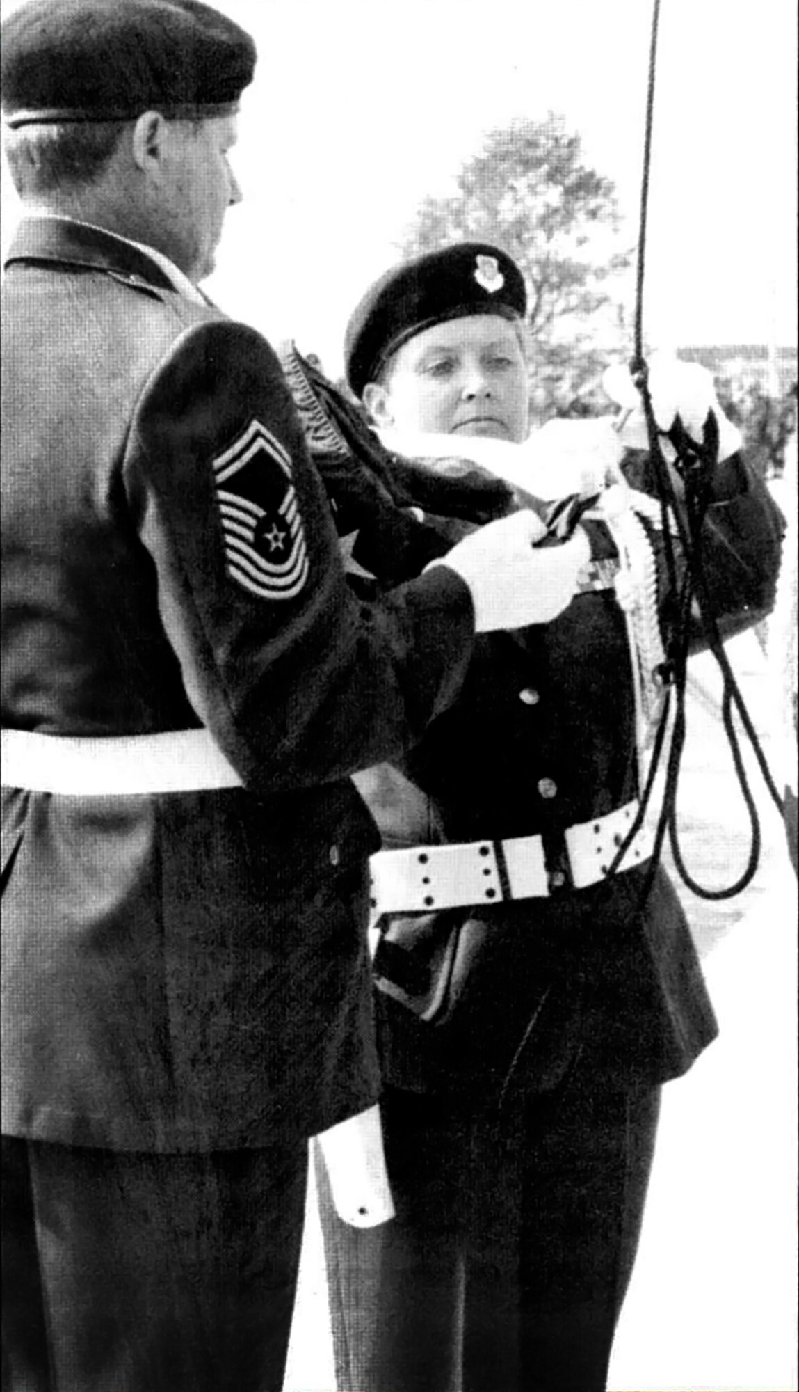 Now retired Chief Master Sgt. Ron Eller and retired Senior Master Sgt. Sandy Montgomery, 434th Air Refueling Wing ceremonial guardsmen, prepare to raise an American flag over the newly realigned Grissom Air Reserve Base, Ind., Oct. 1, 1994. Grissom commemorated its 20-year anniversary realignment as a reserve base Oct. 1., 2014. (U.S. Air Force photo/Tech. Sgt. Tenna Boone) 
