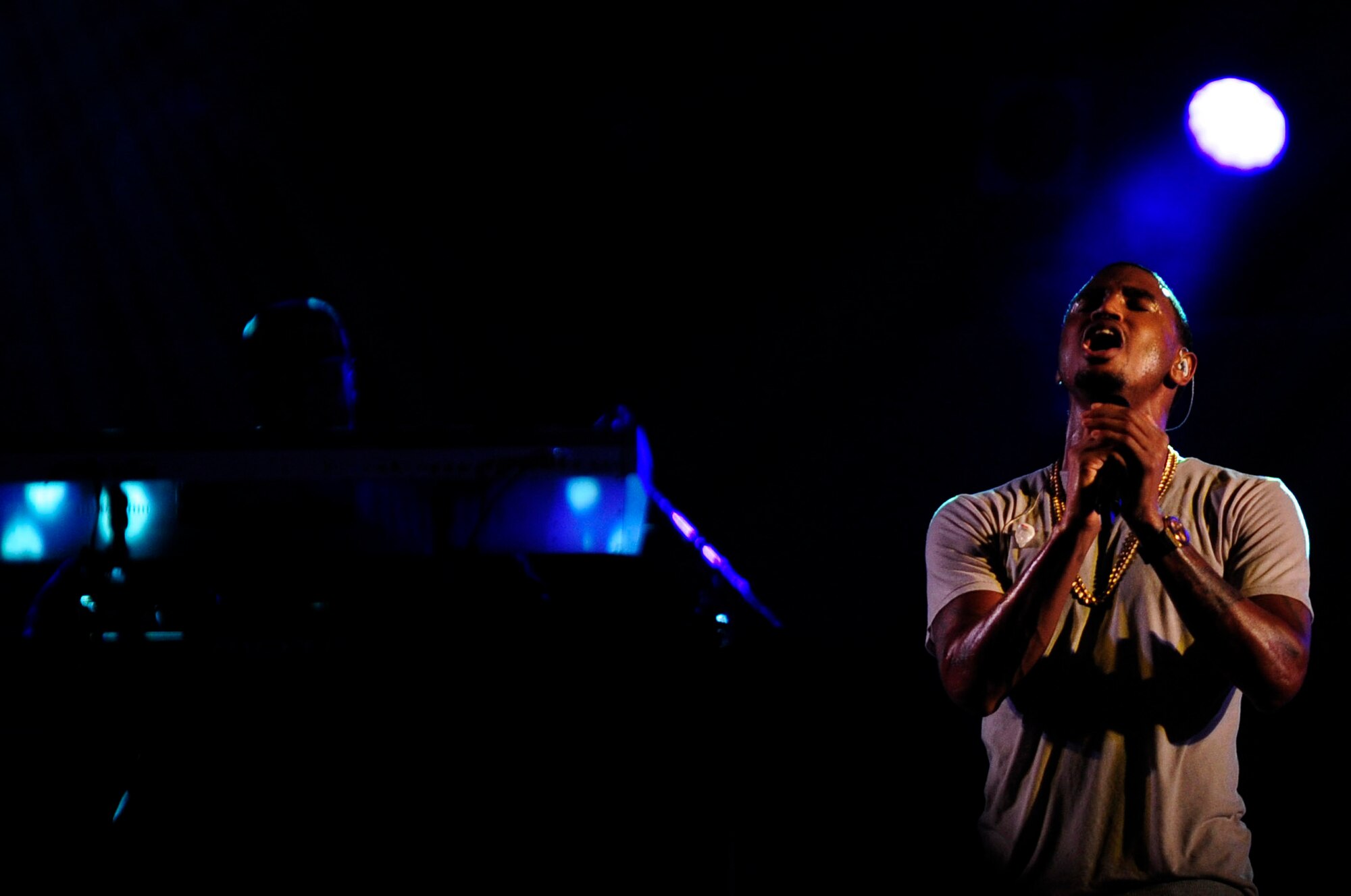 Trey Songz holds the final note of one of his songs during his concert on Kadena Air Base, Japan, Oct. 4, 2014. Trey Songz performed in Okinawa Japan as part of an 18th Force Support Squadron event for military service members and their dependents. (U.S. Air Force Photo by Tech. Sgt. Darnell T. Cannady/Released)