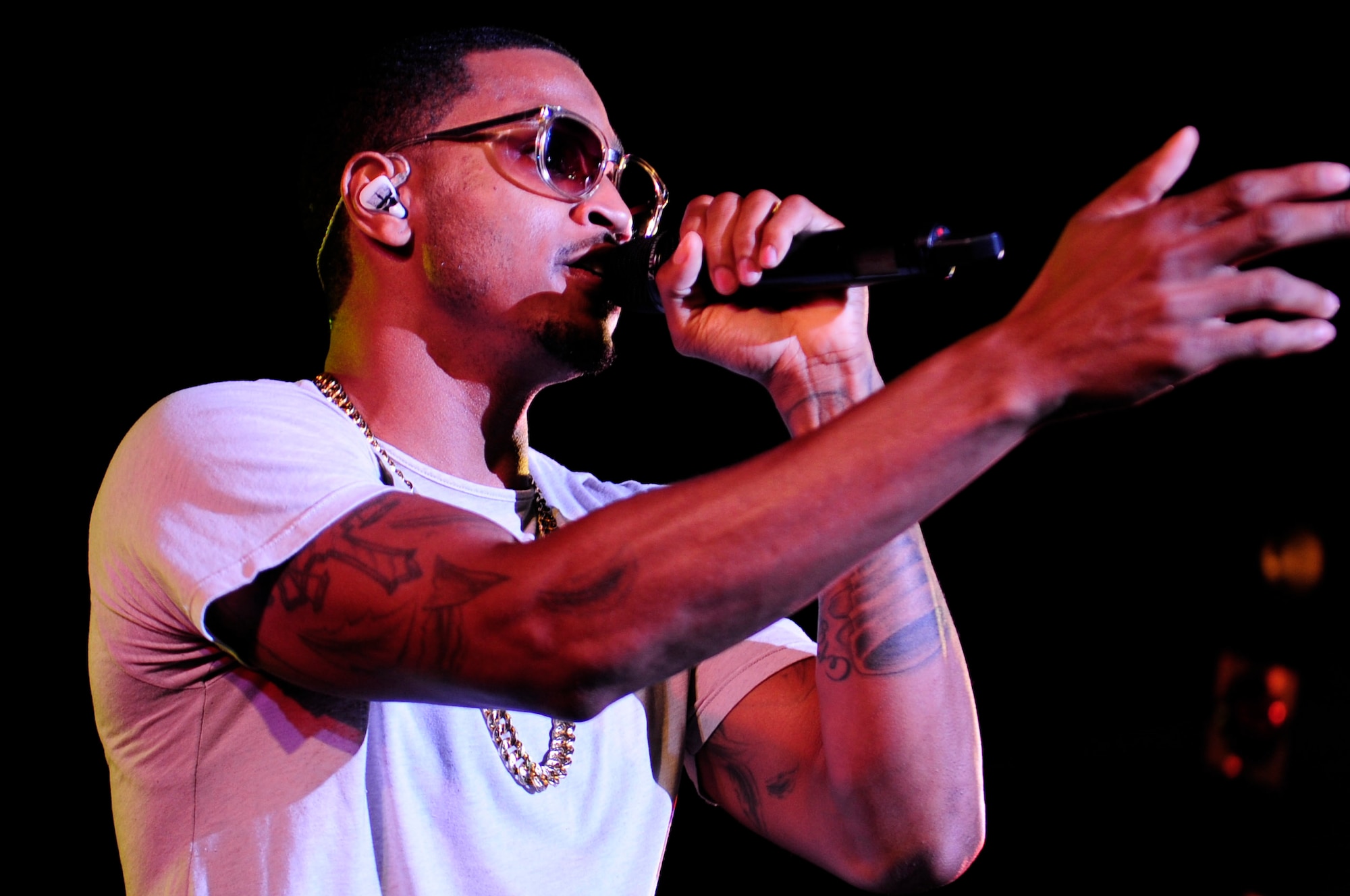 Trey Songz performs a variety of songs during his concert on Kadena Air Base, Japan, Oct. 4, 2014. Trey Songz performed in front of service men and women stationed in Okinawa to say thanks to them and their families. (U.S. Air Force Photo by Tech. Sgt. Darnell T. Cannady/Released) 