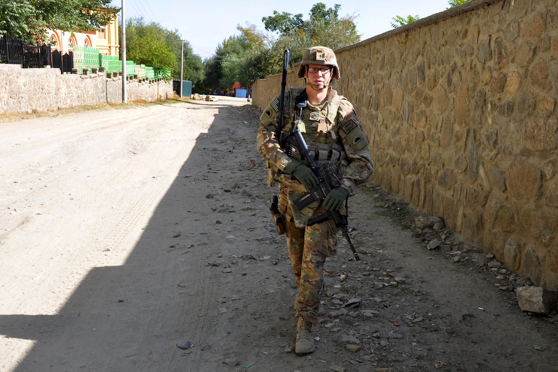 U.S. Army Sgt. Cameron Butler provides security during a commander's emergency response project site visit to the Bagh-e-Omomi Park in Paghman, Afghanistan, Oct. 2, 2014. Butler is an intelligence support specialist assigned to the Oregon Army National Guard's Company B, 2nd Battalion, 162nd Infantry. The soldiers conducted the mission to ensure quality assurance on a perimeter wall, which had been under construction since August 2014.