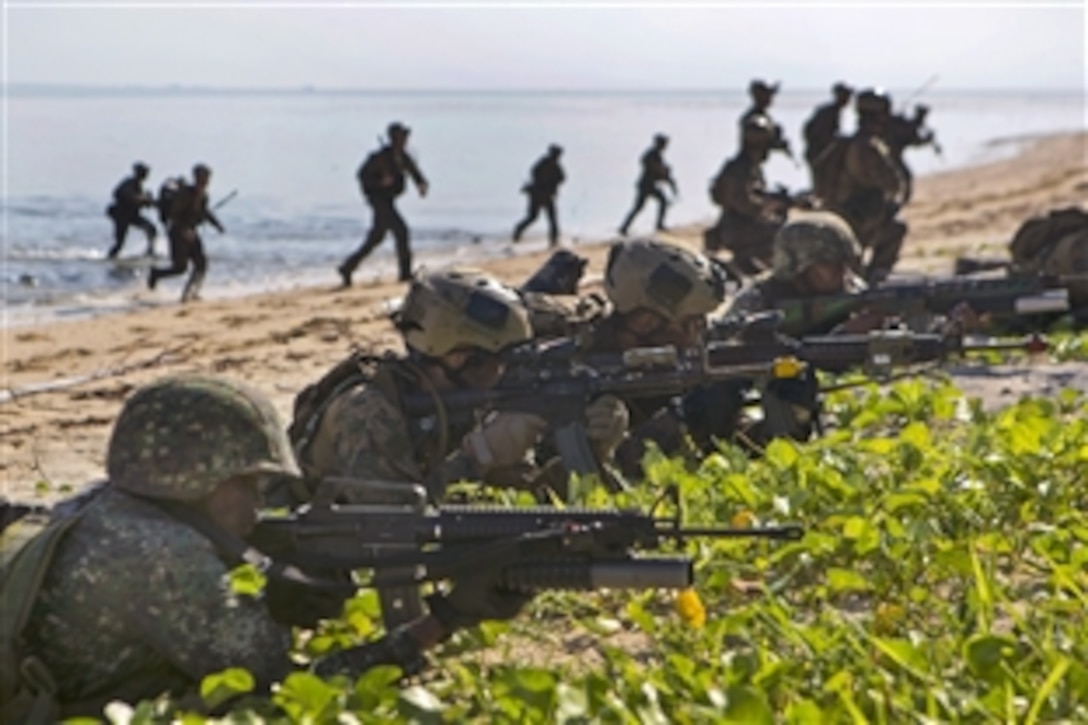 Philippine and U.S. Marines take control of a shoreline to simulate an amphibious raid using combat rubber raiding craft during Amphibious Landing Exercise 15 in Palawan, Philippines, Oct. 2, 2014. The annual exercise, known as Phiblex, aims to strengthen interoperability across a range of capabilities, including disaster relief and contingency operations.