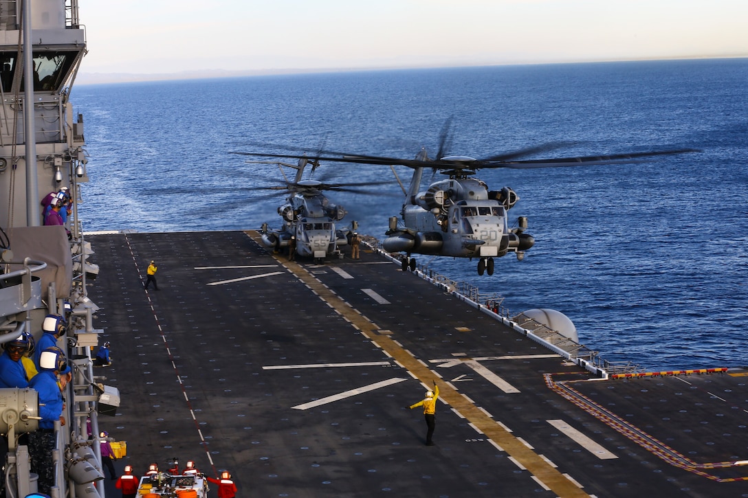 U.S. Marine Corps CH53 Super Stallion with Marine Heavy Helicopter Squadron- 462 takes flight aboard the USS America (LHA-6) in route to San Francisco Fleet Week on Oct. 3, 2014. San Francisco Fleet Week hosted Marines and Sailors that showcased the capabilities of natural disaster relief that the military offers in case of emergencies. (U.S. Marine Corps photo by Cpl. Leah Agler/ Released)