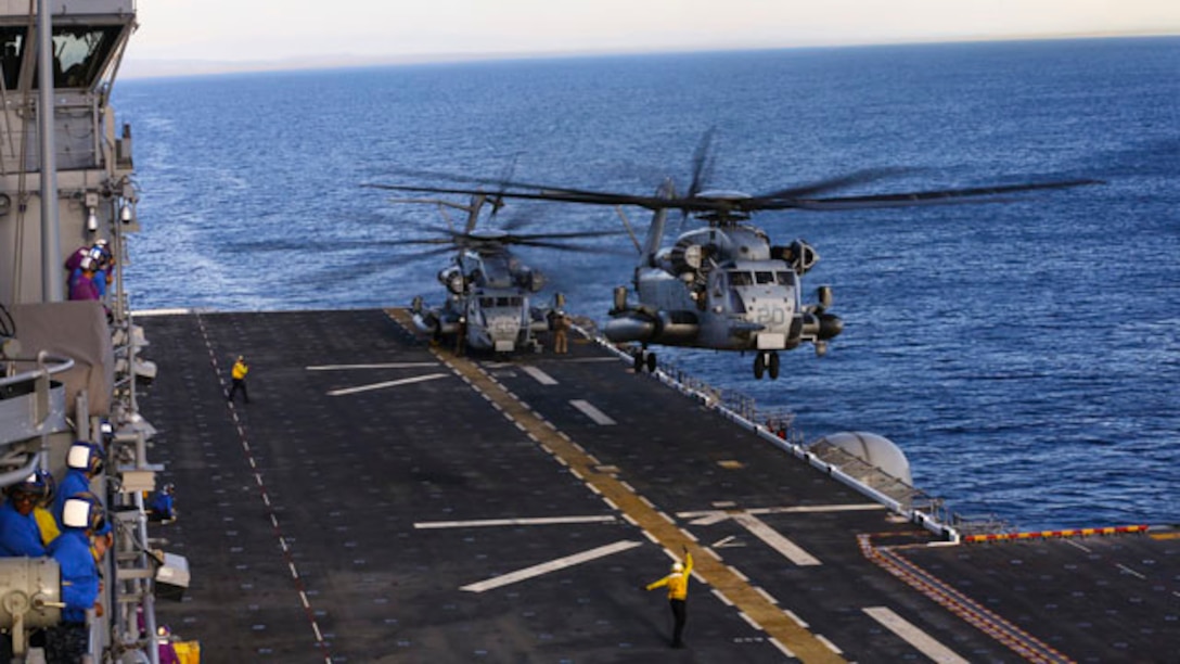 U.S. Marine Corps CH53 Super Stallion with Marine Heavy Helicopter Squadron- 462 takes flight aboard the USS America in route to San Francisco Fleet Week on Oct. 3, 2014. San Francisco Fleet Week hosted Marines and Sailors that showcased the capabilities of natural disaster relief that the military offers in case of emergencies. (U.S. Marine Corps photo by Cpl. Leah Agler/ Released)