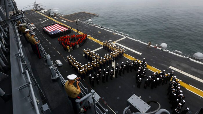 U.S. Marines and Sailors man the rails aboard the USS America in route to San Francisco Fleet Week on Oct. 6, 2014. San Francisco Fleet Week hosted Marines and Sailors that showcased the capabilities of natural disaster relief that the military offers in case of emergencies. (U.S. Marine Corps photo by Cpl. Leah Agler/ Released)
