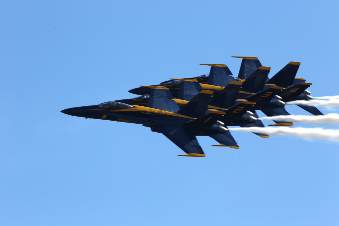 The Navy Blue Angels fly in formation during the 2014 Marine Corps Air Station Miramar Air Show, Oct. 3. The Blue Angels is comprised of 16 officers who serve voluntarily.