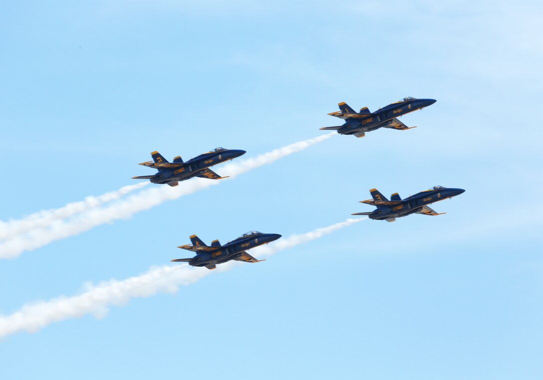 The Navy Blue Angels fly in formation during the 2014 Marine Corps Air Station Miramar Air Show, Oct. 3. The Blue Angels is comprised of 16 officers who serve voluntarily.
