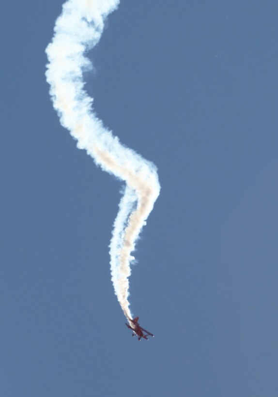 The “Oracle Challenger,” piloted by Sean D. Tucker, dives through the air during the 2014 Miramar Air Show aboard Marine Corps Air Station Miramar, Calif., Oct. 4. Tucker took his aircraft to its limits performing daring stunts.