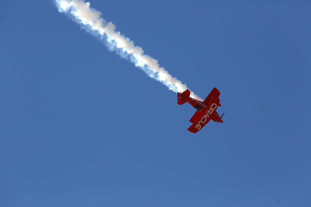 The “Oracle Challenger,” piloted by Sean D. Tucker, dives through the air during the 2014 Miramar Air Show aboard Marine Corps Air Station Miramar, Calif., Oct. 4. Tucker took his aircraft to its limits while diving and rolling int mid air. (Official Marine Corps Photo by Cpl. Raquel Barraza/released)