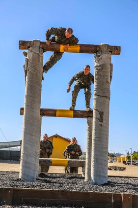 Recruits of Mike Company, 3rd Recruit Training Battalion, attempt the Run, Jump, Swing exercise at Marine Corps Recruit Depot San Diego, Sept. 29. The Run, Jump, Swing is one of many obstacles included in the Confidence Course.