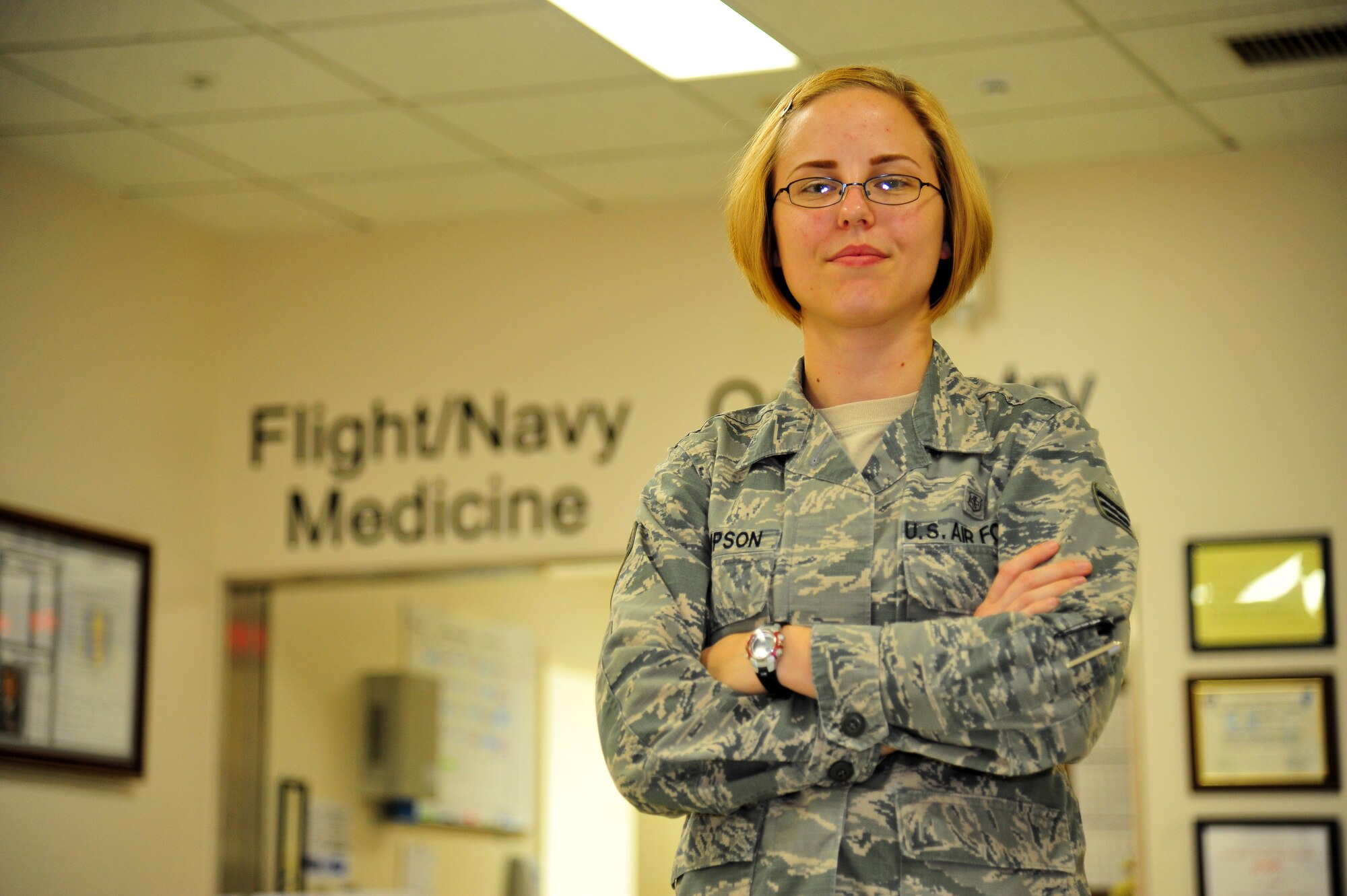 U.S. Air Force Senior Airman Dominique Thompson, 35th Aerospace Medicine Squadron aerospace medical service technician, stands near her work section at Misawa Air Base, Japan, Oct. 1, 2014. Thompson’s responsibilities include managing clearances for security, permanent change of duty station, retraining, special duty, separations and more. (U.S. Air Force photo by Senior Airman Jose L. Hernandez-Domitilo)