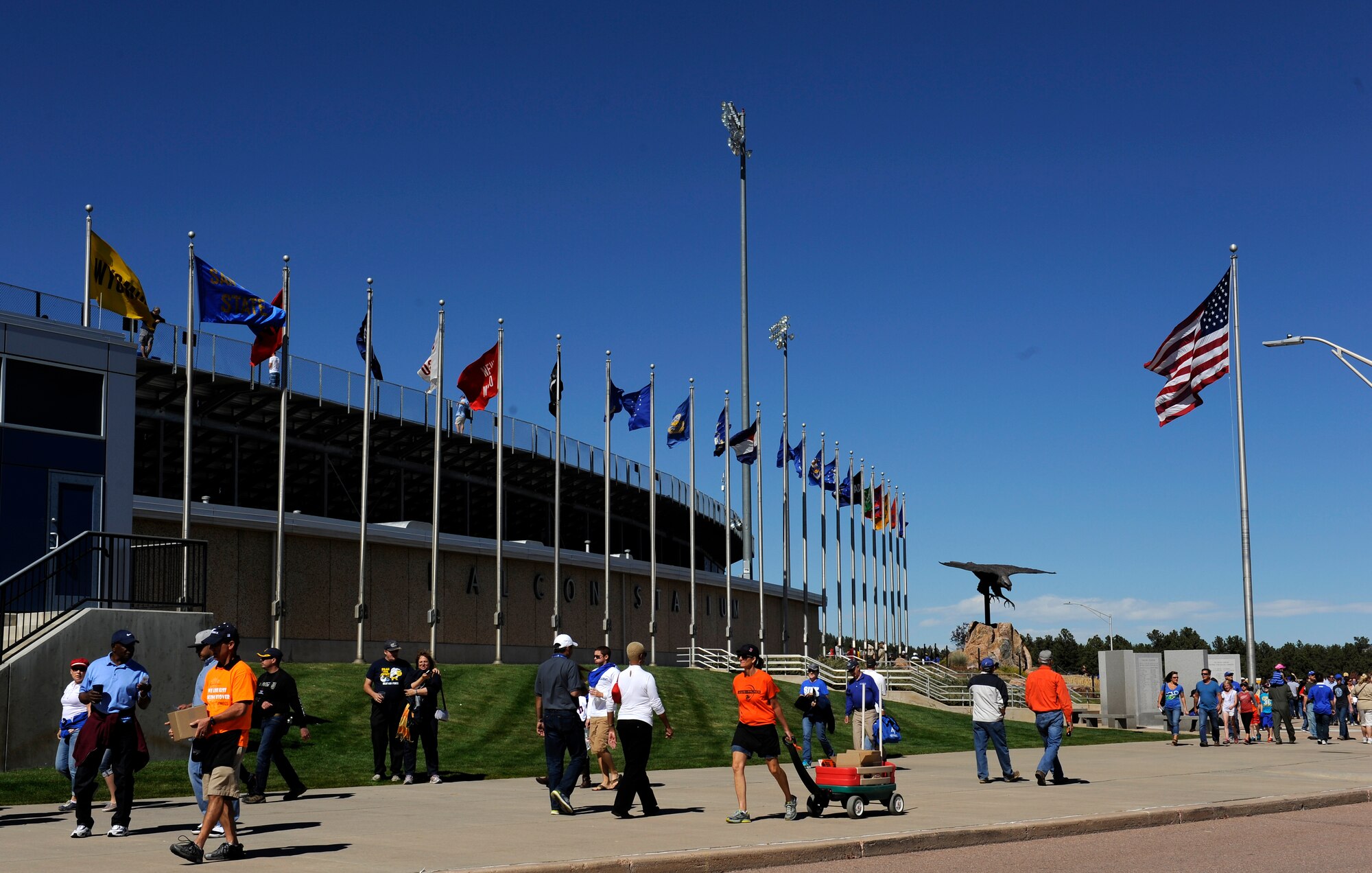 U.S. AIR FORCE ACADEMY, Colo. -- Falcon fans head into the football game, ready cheer on their team. Before the game, many were tailgating in the parking lot, enjoying free food provided by the 21st and 50th Space Wings. Tailgating takes place before every Falcon home game to bring fans together to get pumped for the game. (U.S. Air Force photo/Airman 1st Class Rose Gudex)