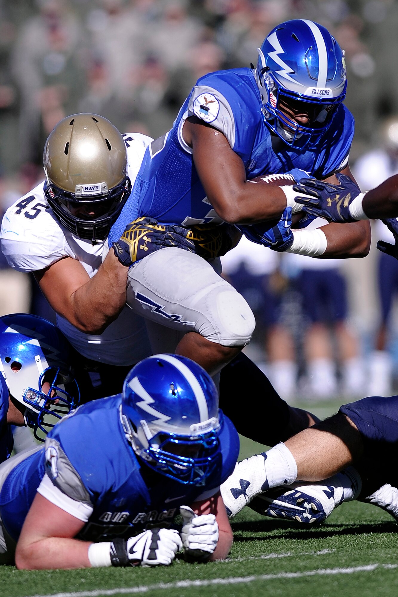 Falcon fullback Broam Hart bull-rushes ahead for yardage against Navy Oct. 4 in Falcon Stadium. Hart carried four times for 17 yards as the Falcons went on to sink Navy 30-21. (U.S. Air Force photo Mike Kaplan)