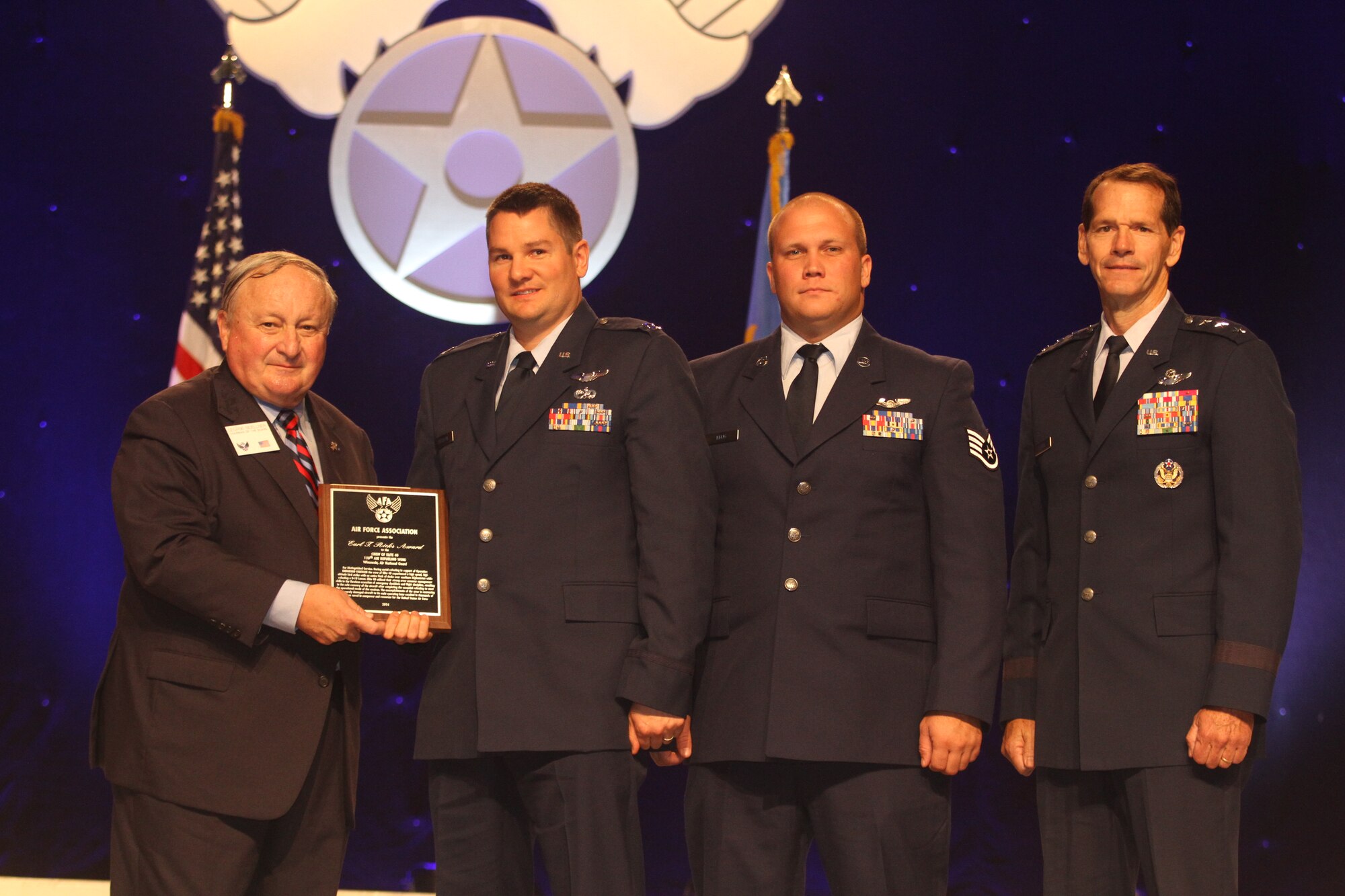 Capt. Rory Cattelan, a pilot with the 128th Air Refueling Wing and Staff Sgt. Tyson Krug, a boom operator with the 128 ARW, receive the AFA Earl T. Ricks Award, which is given to Air National Guard members who have demonstrated outstanding airmanship, from Air Force Association at the 2014 Air & Space Conference and Technology Exposition in Washington D.C. Sept. 18, 2014.