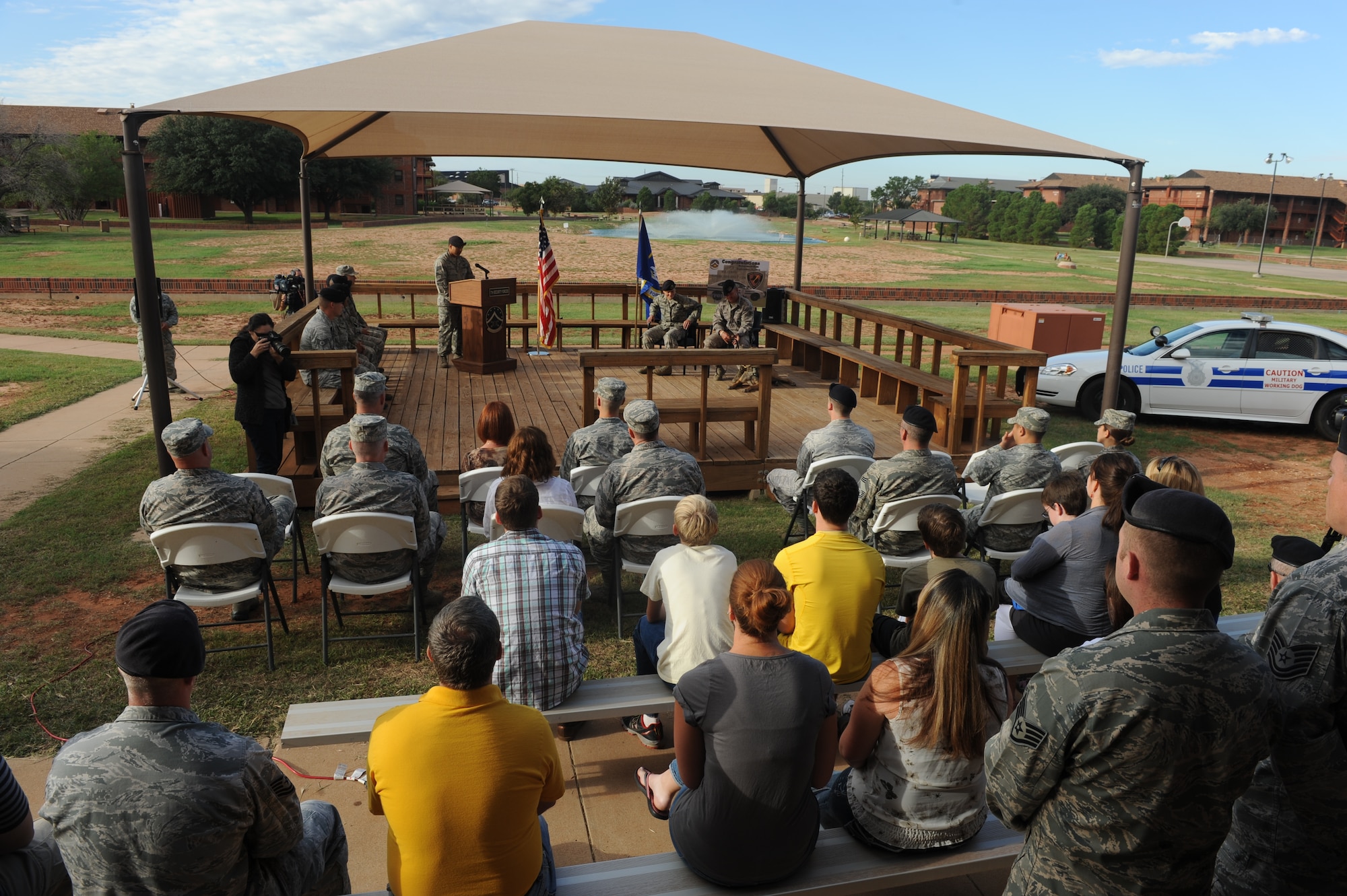 Members of team Dyess attend the retirement of military working dog FForde Sept. 25, 2014 at Dyess Air Force Base, Texas. FForde served Dyess by conducting daily random antiterrorism sweeps across the installation, ensuring the safety of B-1B Lancers, C-130Js, the munitions storage area and base aircraft resources.(U.S. Air Force photo by Airman 1st Class Autumn Velez/Released)