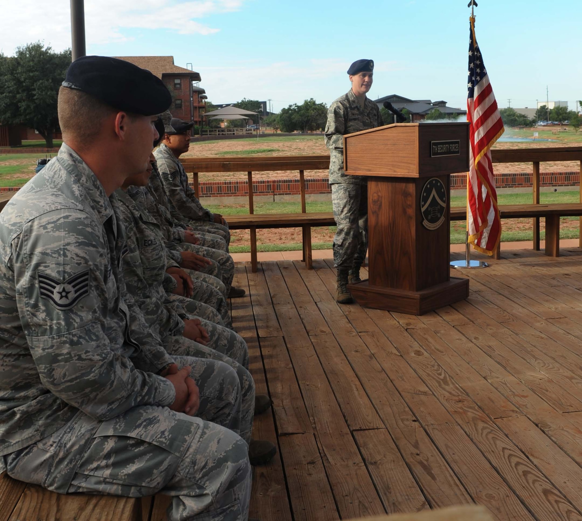 U.S. Air Force Maj. Sarah Babbitt, 7th Security Forces Squadron commander, speaks at military working dog (MWD) FForde’s retirement Sept. 25, 2014 at Dyess Air Force Base, Texas. FForde started his career in the military the day he was born into the MWD “Puppy Program”. Once old enough, he was enlisted in the United States Air Force and began his training in explosive detection and patrolling.  After FForde was fully certified, he was assigned to Dyess. (U.S. Air Force photo by Airman 1st Class Autumn Velez/Released)