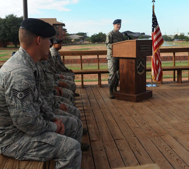 U.S. Air Force Maj. Sarah Babbitt, 7th Security Forces Squadron commander, speaks at military working dog (MWD) FForde’s retirement Sept. 25, 2014 at Dyess Air Force Base, Texas. FForde started his career in the military the day he was born into the MWD “Puppy Program”. Once old enough, he was enlisted in the United States Air Force and began his training in explosive detection and patrolling.  After FForde was fully certified, he was assigned to Dyess. (U.S. Air Force photo by Airman 1st Class Autumn Velez/Released)