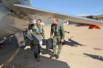 Maj. Shad Stromberg, 419th Fighter Wing pilot, and Ted Ligety, alpine ski racer and Olympic gold medalist, perform a pre-flight check on an F-16 here Oct. 6. (U.S. Air Force photo/Ronald Bradshaw)