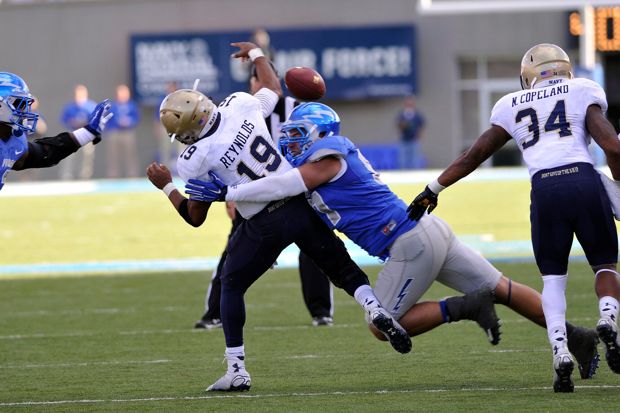 Falcon nose guard Troy Timmerman takes down Navy Midshipman Keenan Reynolds Oct. 4 during the Air Force vs. Navy game here. The Falcons won 30-21. (U.S. Air Force photo/Jason Gutierrez)