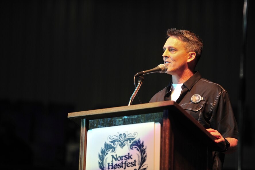 Col. Jason Armagost, 5th Bomb Wing commander, speaks at the annual Norsk Hostfest in Minot, N.D., Oct. 4, 2014. This was the 37th annual Norsk Hostfest celebrating the Scandinavian heritage found in North Dakota. The festival also offered a military appreciation offering free admission to military members and their families. (U.S. Air Force photo/Senior Airman Malia Jenkins)  