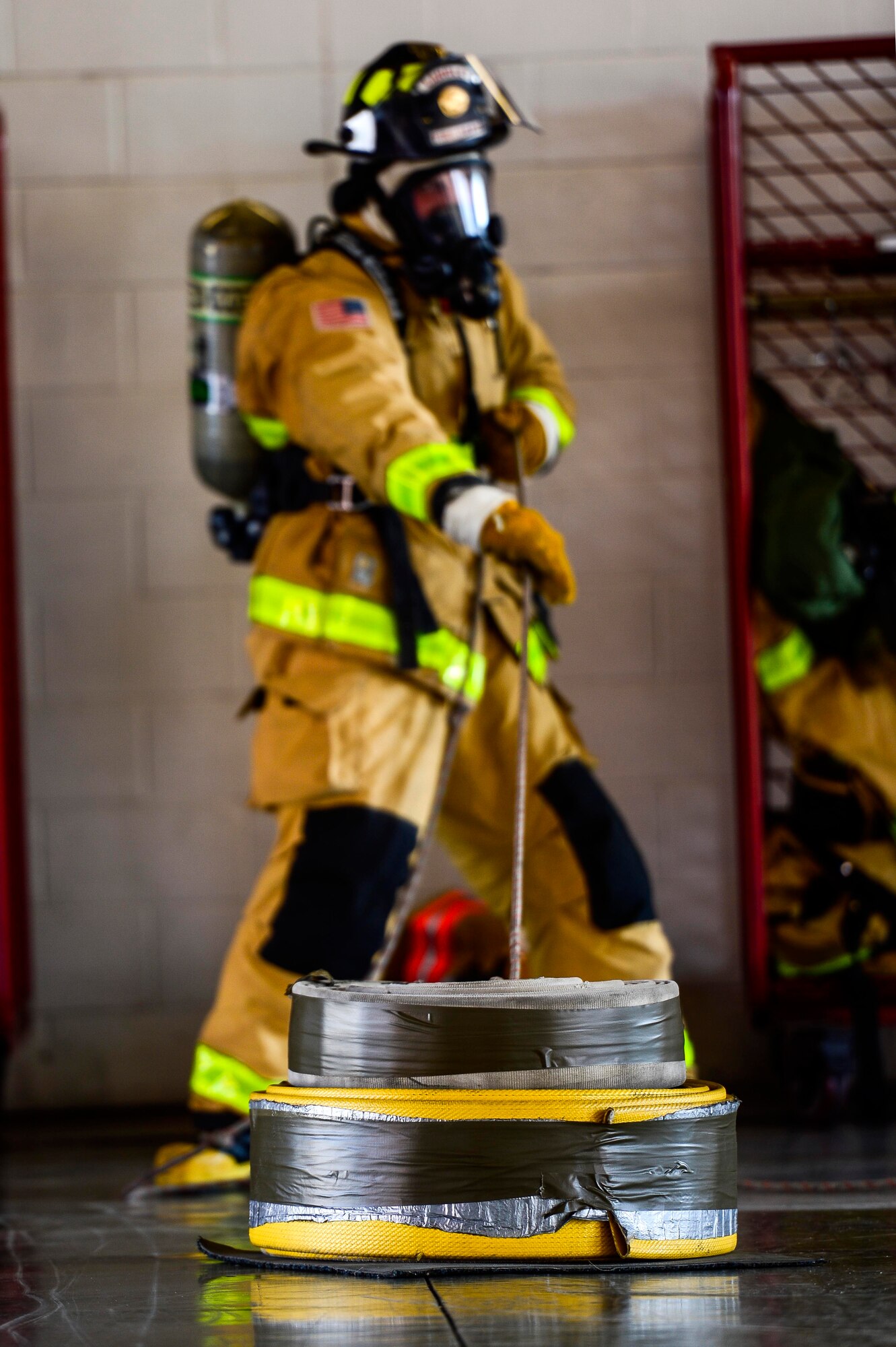 U.S. Air Force Airman 1st Class Colton Peer, 633rd Civil Engineer Squadron firefighter, pulls a keiser sled during a firefighter challenge at Langley Air Force Base, Va., Oct. 1, 2014. Firefighters were required to complete a ten-station course in eight minutes or less. (U.S. Air Force photo by Senior Airman Kayla Newman/Released)