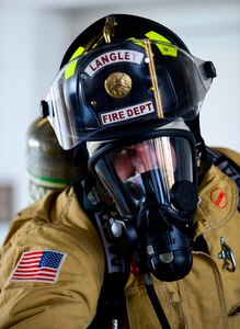 A U.S. Air Force firefighter assigned to the 633rd Civil Engineer Squadron participates in a firefighter challenge at Langley Air Force Base, Va., Oct. 1, 2014.  The challenge tested firefighters on their ability to perform various tasks needed to combat fires. (U.S. Air Force photo by Senior Airman Kayla Newman/Released)