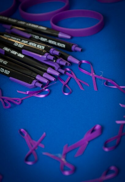 Ribbons rest on a table on Minot Air Force Base, N.D., Oct. 3, 2014. The purple ribbons are worn as a symbol to honor victims and survivors of domestic violence. According to www.womenslaw.org, someone is physically, sexually, psychologically or verbally abused by a spouse or partner every 15 seconds. (U.S. Air Force photo/Airman 1st Class Sahara L. Fales)