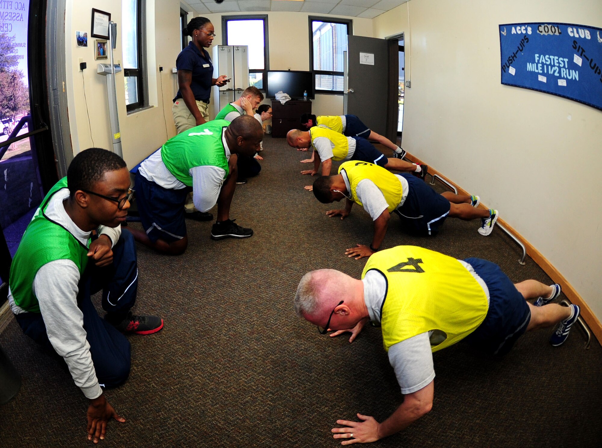 U.S. Air Force Airmen partake in a physical fitness assessment at Langley Air Force Base, Va., Oct. 6, 2014. Airmen are evaluated in four portions of the Air Force PT test – push-ups, sit-ups, abdominal circumference measurement and a 1.5-mile run. (U.S. Air Force photo by Airman 1st Class Areca T. Wilson/Released) 