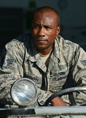 U.S. Air Force Senior Airman Stephen Caseman, 20th Aircraft Maintenance Squadron weapons load crew member, with the Gamblers Aircraft Maintenance Unit, prepares to load ammunition onto an F-16CM Fighting Falcon during a weapons load crew competition at Shaw Air Force Base, S.C., Oct. 3, 2014. Four teams from different fighter squadrons loaded munitions on an F-16 during two separate timed competitions. (U.S. Air Force photo by Senior Airman Tabatha Zarrella/Released) 